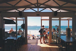 Friends gathering at a casual waterfront venue.